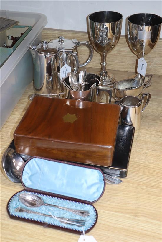 A collection of plated items and cased flatware, including a pair of Kings College race trophies, etc